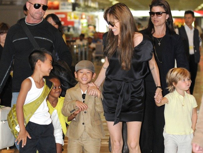 Angelina Jolie black silk mini dress, flip flops, Pax, Maddox, Shiloh, Zahara