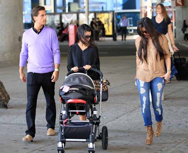 Kourtney Kardashian, black top, diaper bag, stroller, kim kardashian, ripped jeans, animal print boots, beige top, brown shirt, scott disick, lavendar sweater, 