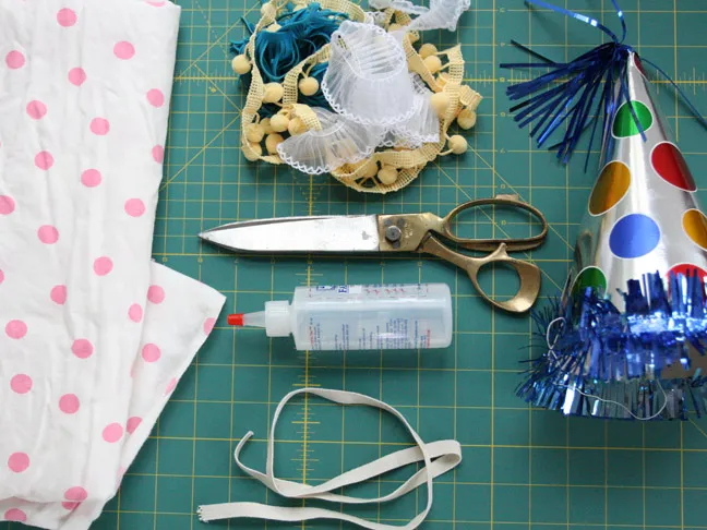 supplies for party hat making include craft glue, scissors and other embellishments