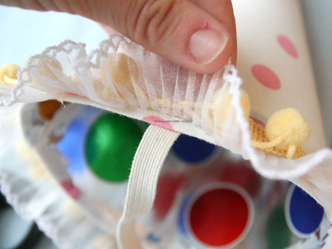 use a staple to attach the trim to the party hat