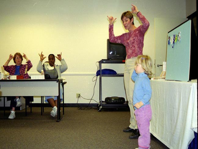 Monta Briant and her child teaching a class to sign language