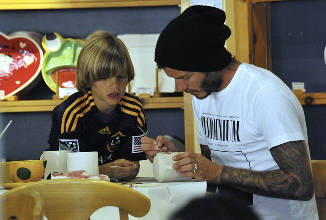 David Beckham, black knit hat, White shirt