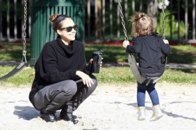 Jessica Alba wearing gray pants and a black sweater with a black headband, Jessica alba plays at park with honor marie