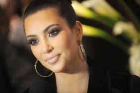 kim kardashian, black top and earrings