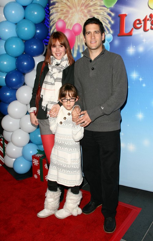 Molly Ringwald, red leggings, gray skirt, scarf