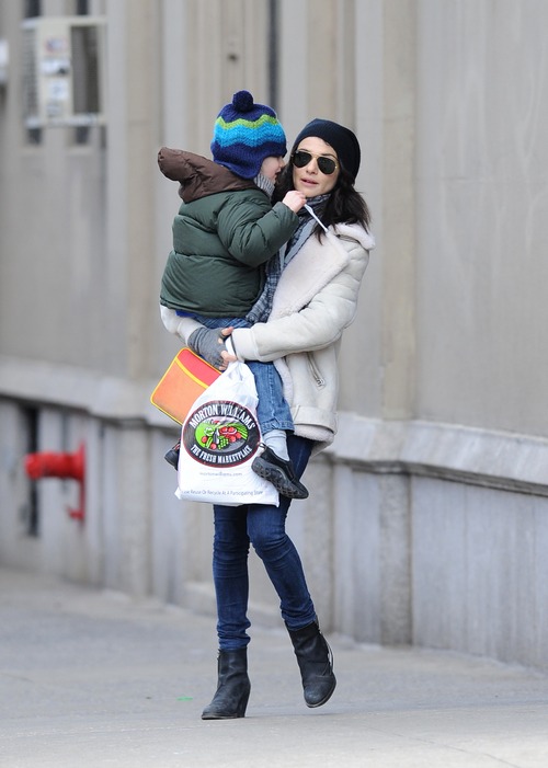 Rachel Weisz winter coat, whit jacket, black boots, jeans, knit black hat