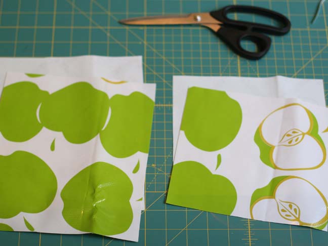 green apple oilcloth cut in half
