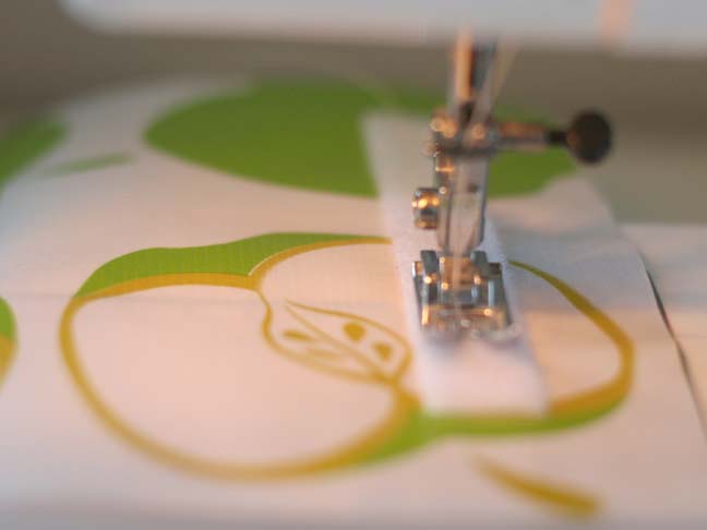 sewing machine sewing velcro on fabric