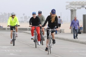 Kate Hudson, bike helmet, black top, black bike shorts