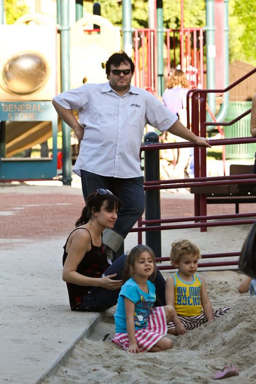 Jack Black, white shirt, rolled jeans, black shoes, sunglasses