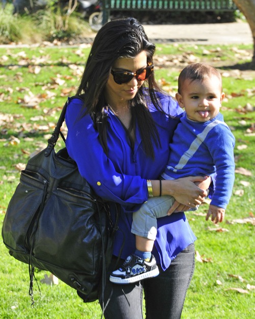 Kourtney Kardashian, blue shirt, sunglasses, 