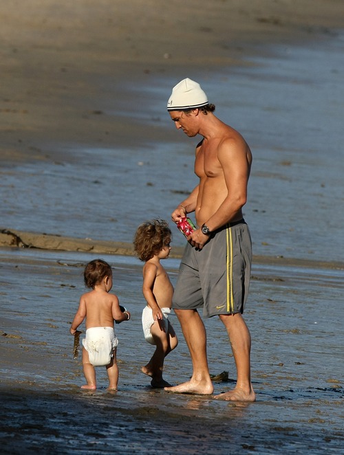 Matthew McConaughey, white hat, gray shorts, 