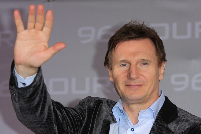 Liam Neeson, blue shirt, gray jacket