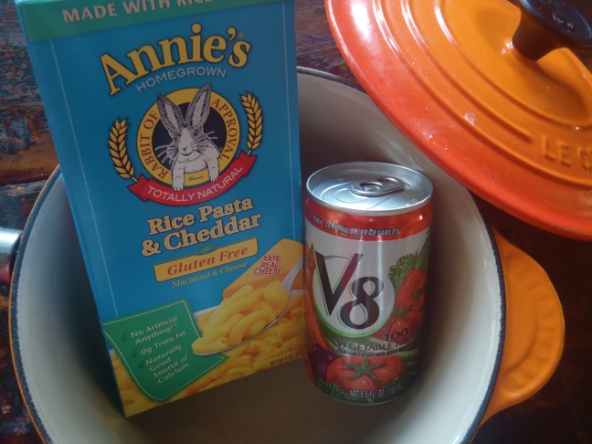 Annie's Homegrown Mac and Cheese pictured with a can of V8 in a empty pot