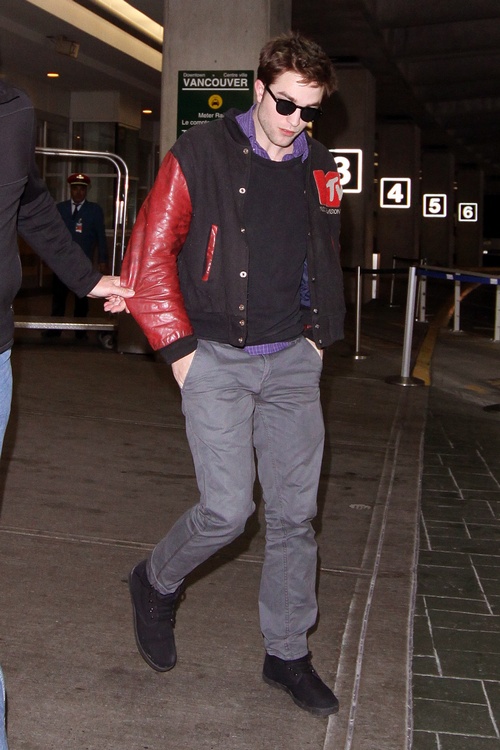 Robert Pattinson, gray khaki pants, MTV jacket, sunglasses