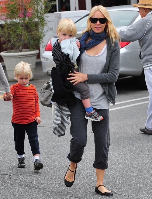 Naomi Watts, scarf, gray pants, gray top