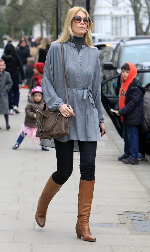Claudia Schiffer, gray sweater, black leggings, boots