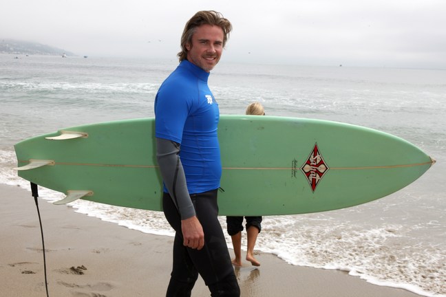 Sam Trammell, surf board, wet suit