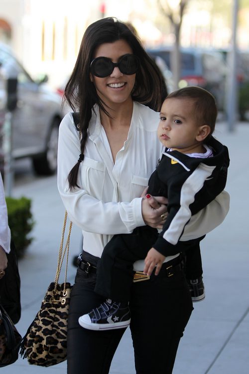 Kourtney Kardashian, sunglasses, white blouse, jeans, animal print purse