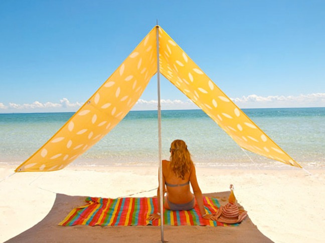 A Simple & Stylish Solution For Staying Cool On The Beach