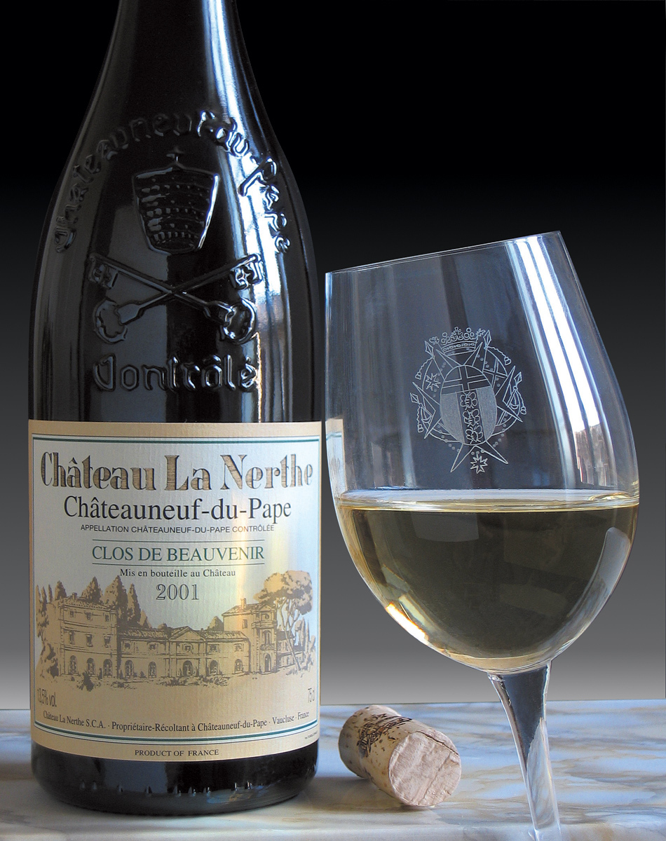 A bottle and glass of chateau du pape