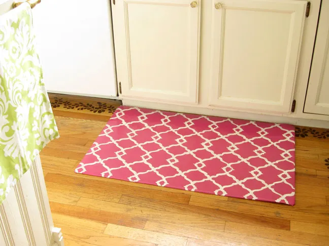 pink quatrefoil rug on a wooden floor