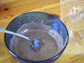 Step 1- Melted chocolate in a blue glass bowl