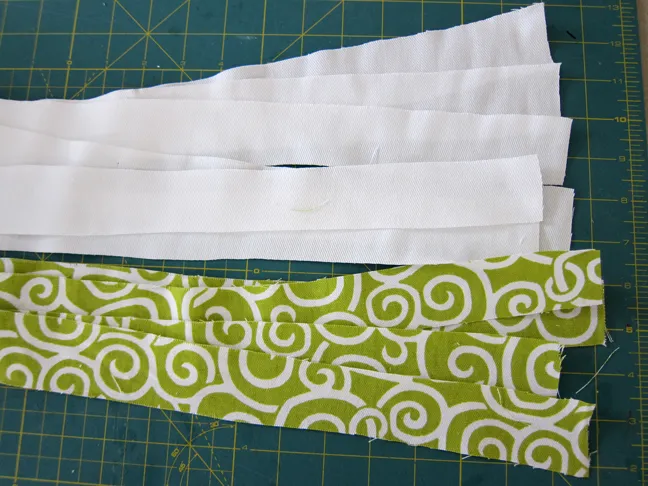 Strips of white and green fabric to be made in to the valance