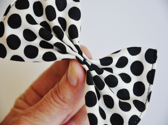 cinching in the polka dot bow