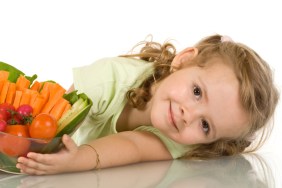 Little girl with vegetables