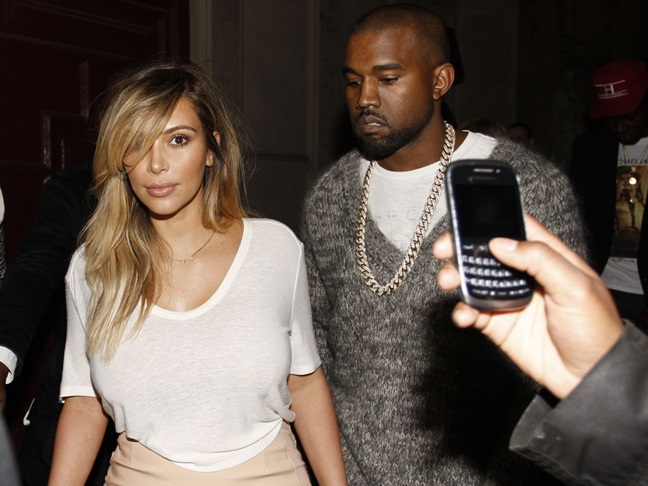 Kim Kardashian and Kanye West outside their hotel