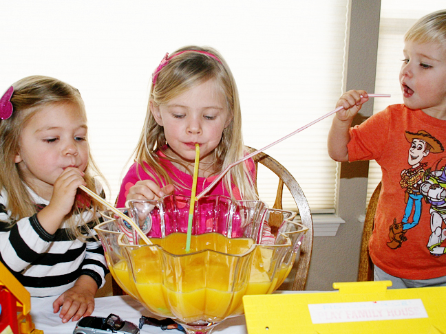 kids-drinking-orange-juice-punch-bowl
