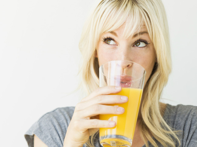 blonde-woman-drinking-orange-juice