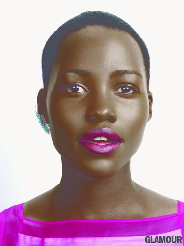 Lupita Nyongo with fuschia lips staring off in to the distance