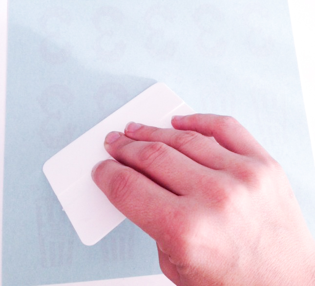adding adhesive paper to the tattoo paper