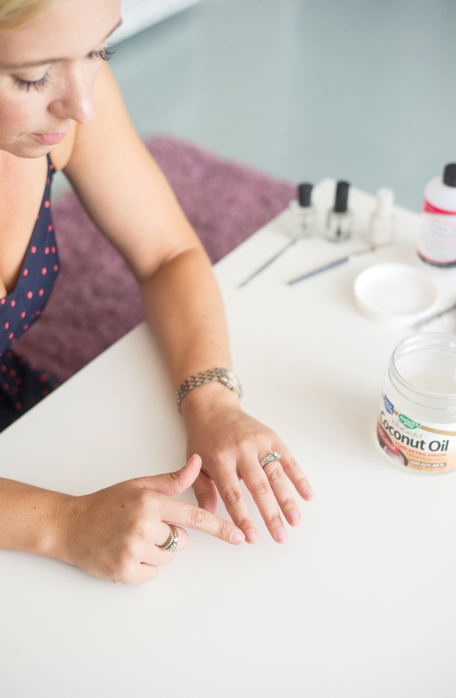 applying coconut oil to cuticles to soften