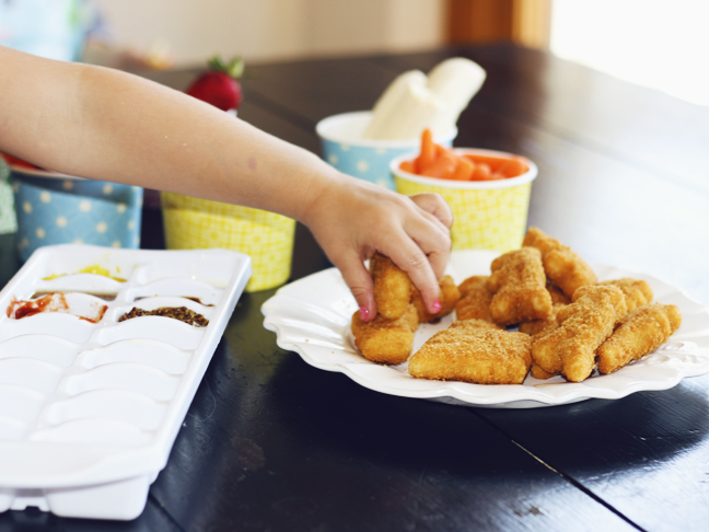 hand reaching for nuggets