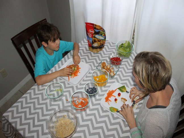 Mother and Son at dinner table talking