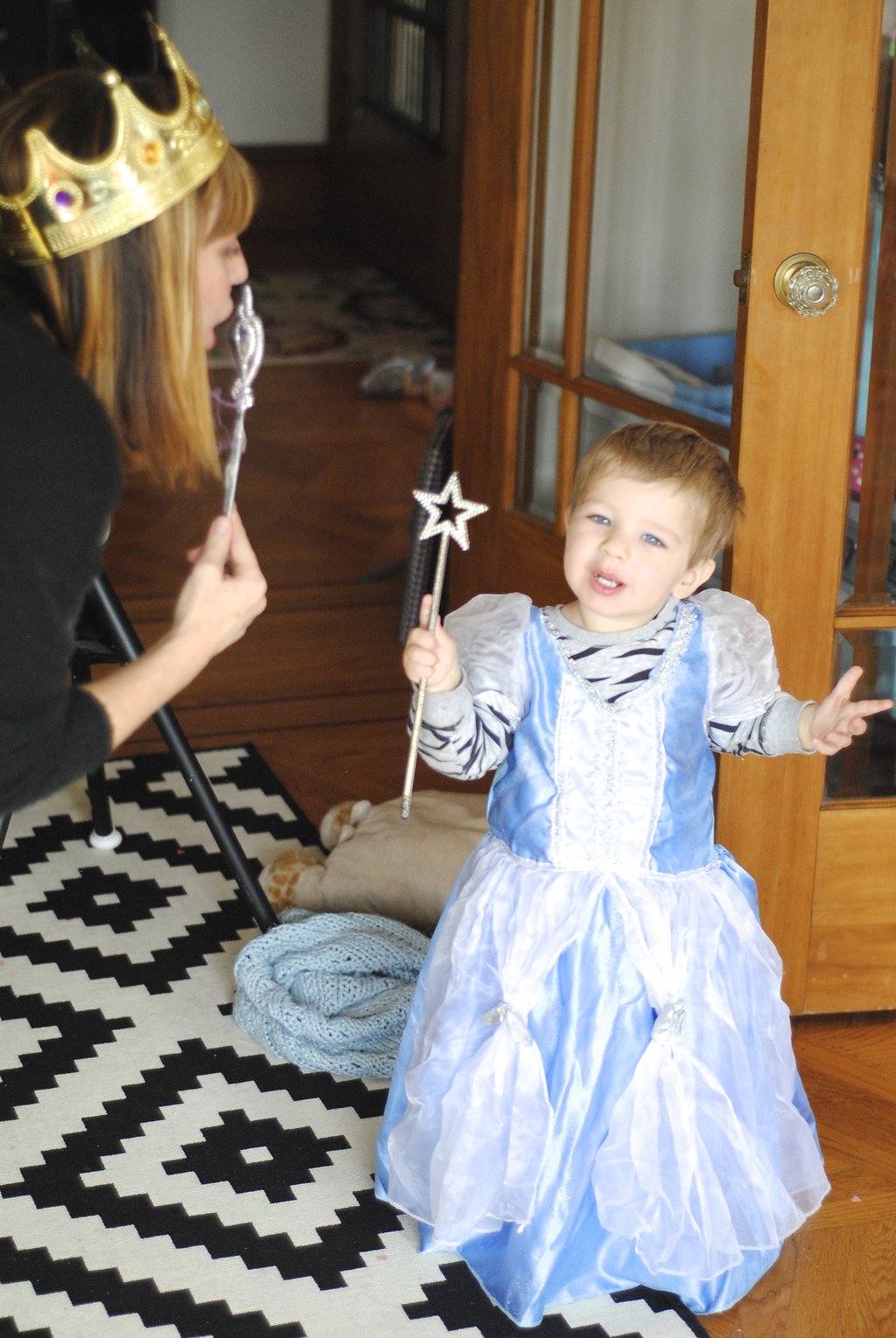 little boy dressed up as princess and dancing