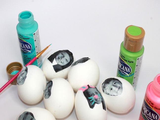 paint silly faces on easter eggs