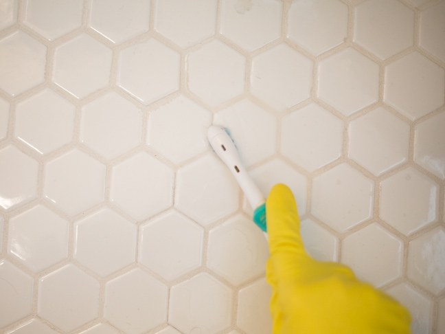 tile-toothbrush-glove-hand