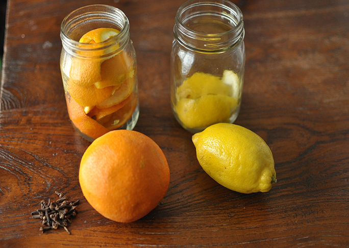 lemon and orange all natural household cleaner in mason jars
