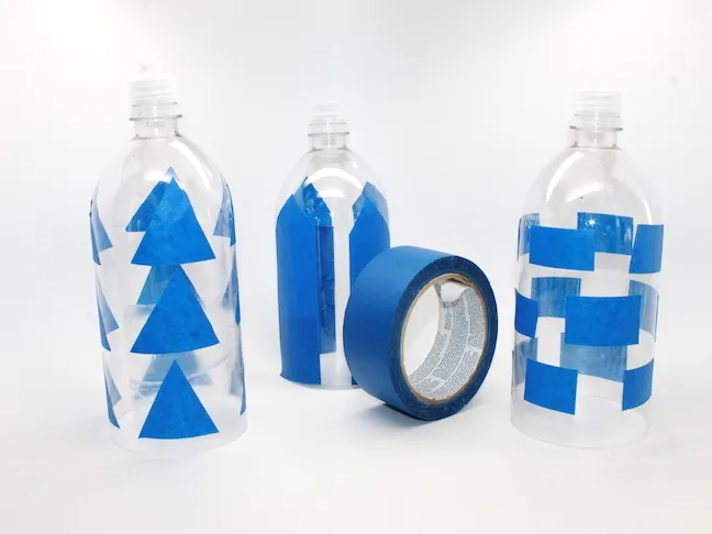 Step 2 - painter's tape on recycled water bottle