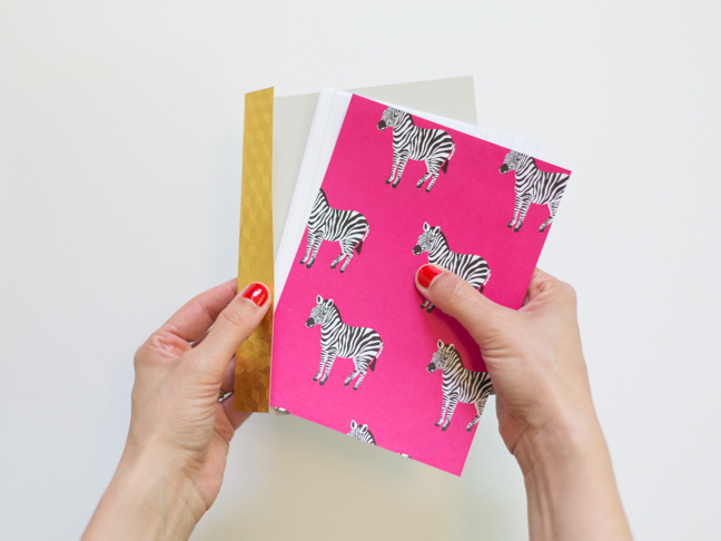 pink-zebra-paper-stacked-paper-gold-binding