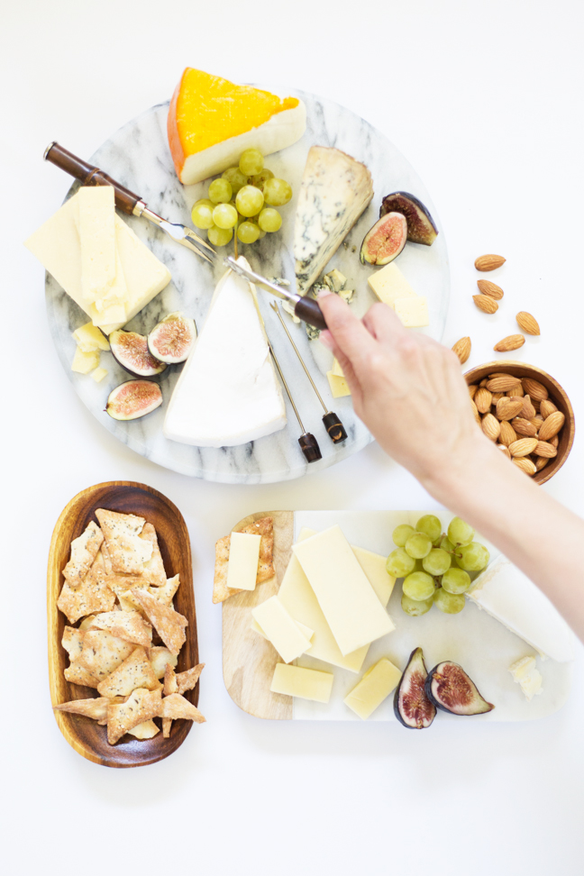 cheese-boards-hand-reaching