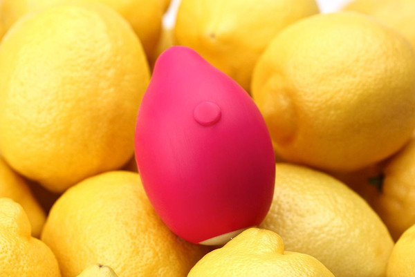 A pink Limon Vibe pictured among real lemons