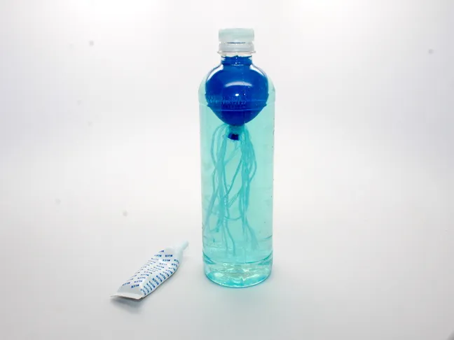 balloon in water bottle with blue water