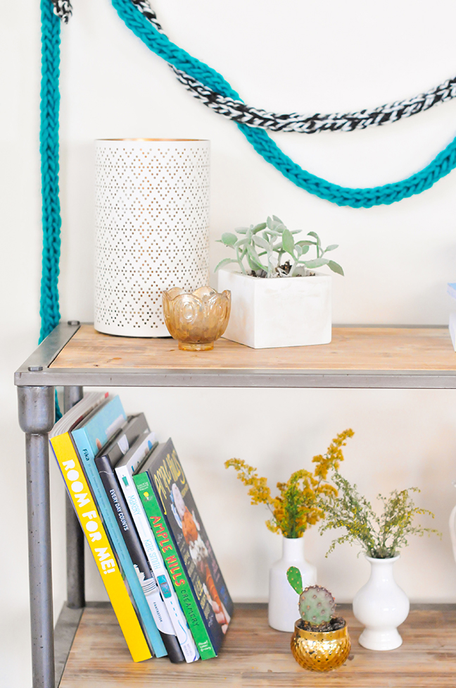 DIY Fingerknit Garlands styled on a wall