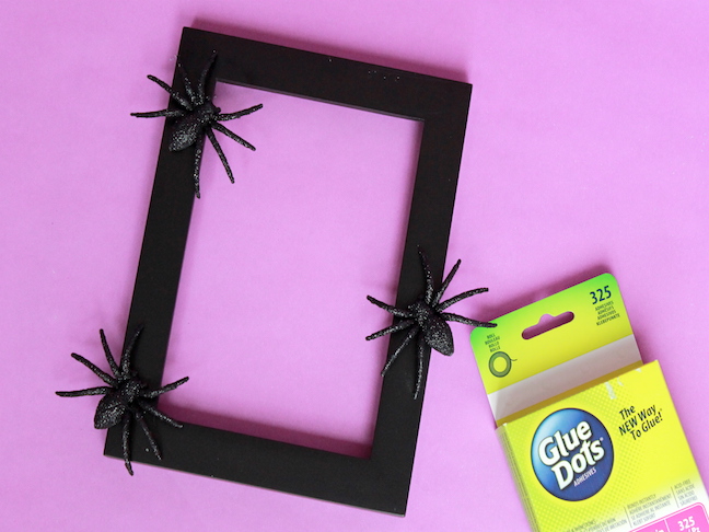 Frame Step 3 glitter spiders on black photo frame