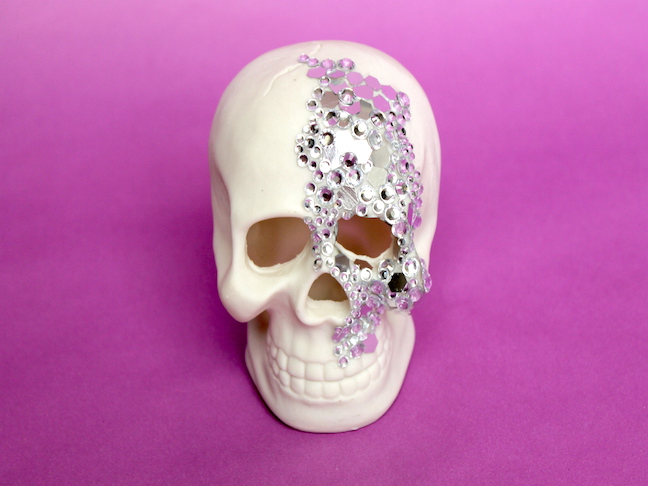 skull with rhinestones and sequins on it